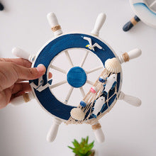 Mediterannean Style Photo Wall with Wooden Crafts Ship's Wheel
